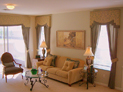 Shaped cornice and drapes for living room windows in NYC