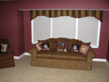 Box pleated tapered valance and honeycomb shades for living room windows