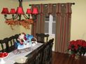 Empire valance on decorative hardware and drapes for dining room window