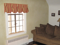 Queen Anne valance and wood blinds for living room window in Westchester, New York